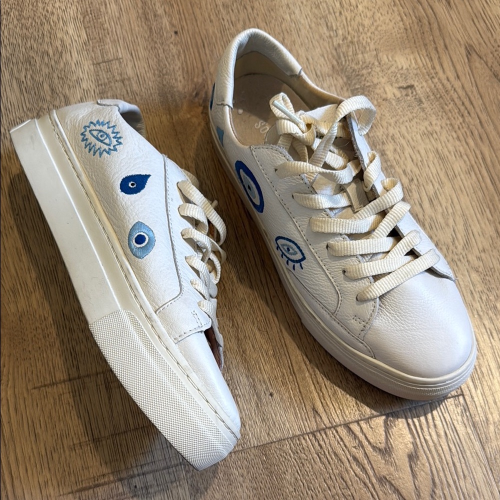 White Sneakers with Blue Eye Design